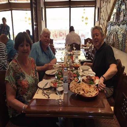 Input photo: people sharing a meal at a restaurant