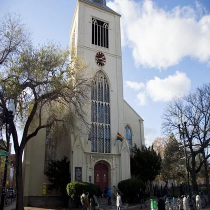 Input photo: a stone church with a clock tower